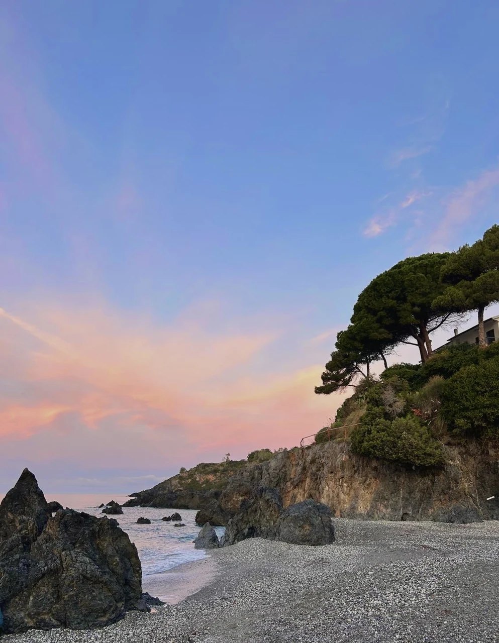 A pink sky over the rocks