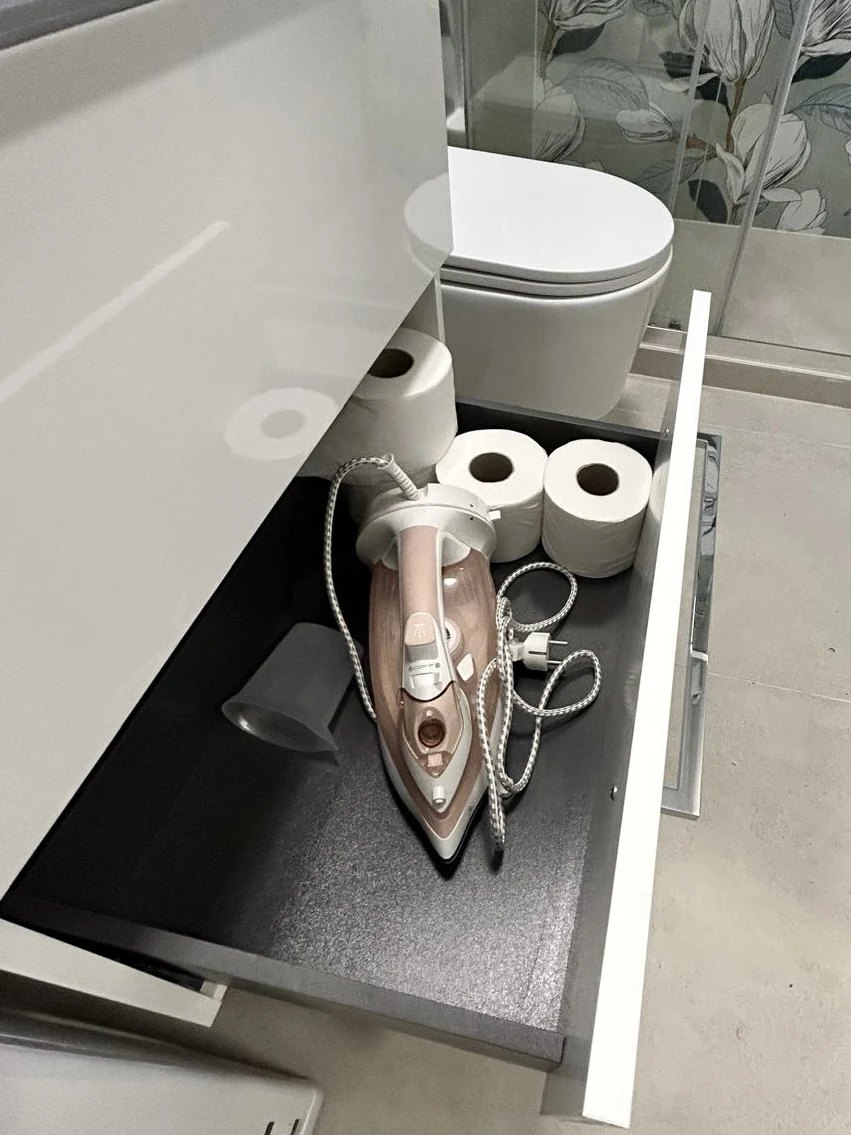 The iron and a supply of toilet paper