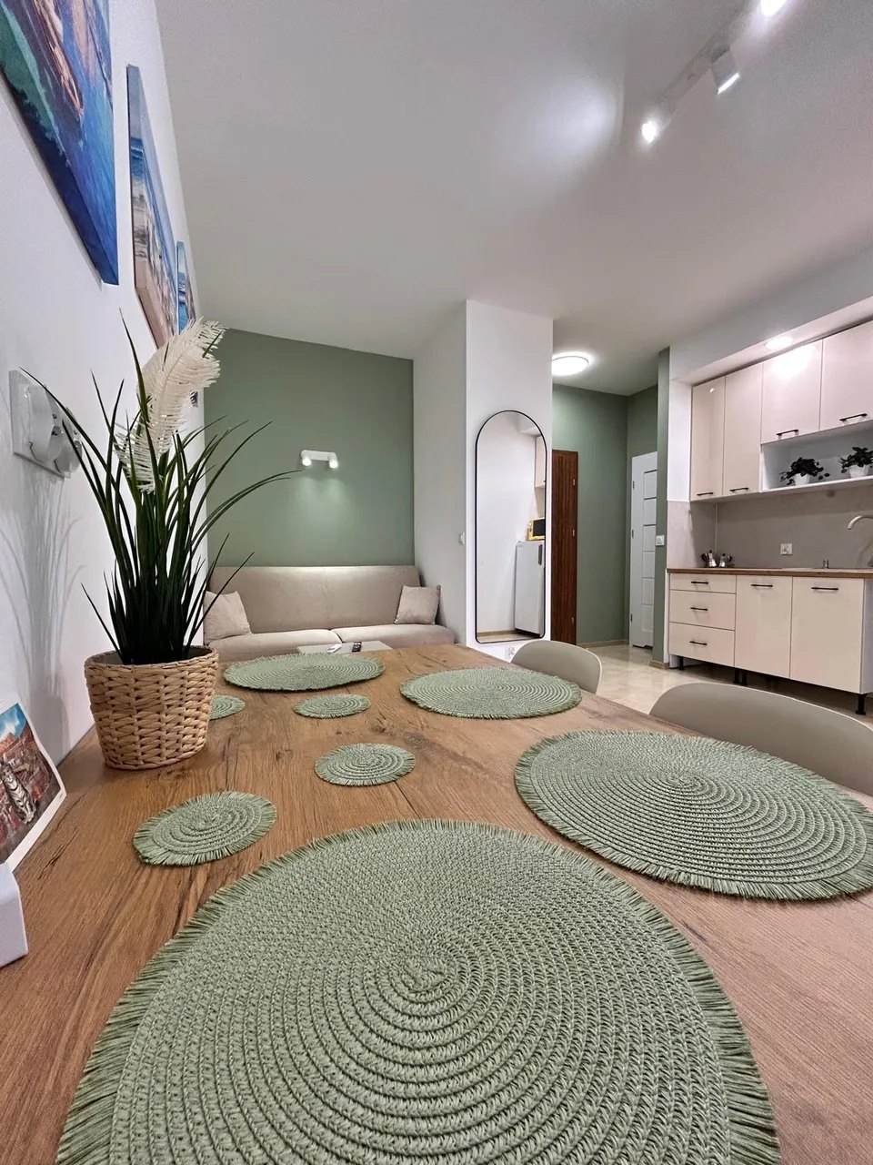 The table laid, the kitchen behind it